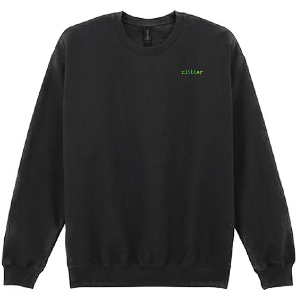 A black crewneck sweatshirt with the word 'glitter' printed in a small green font on the left chest, displayed against a solid white background.
